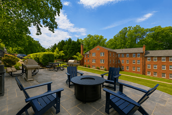 Park crest apartments terrace with fire pit and lounge chairs